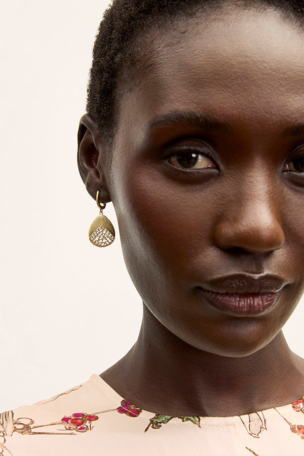 image of a woman wearing the benia earring | Exclude | Grid Hover