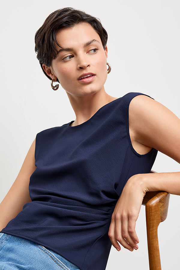 front image of a woman wearing the brooke top in soft navy | Exclude | Grid