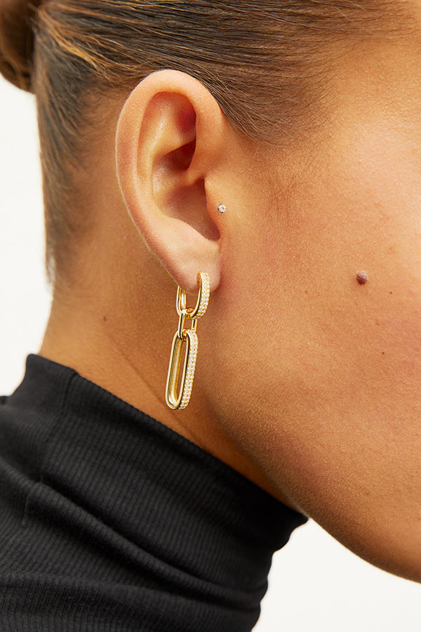 image of a woman wearing the flora earrings in gold | Exclude | Grid Hover