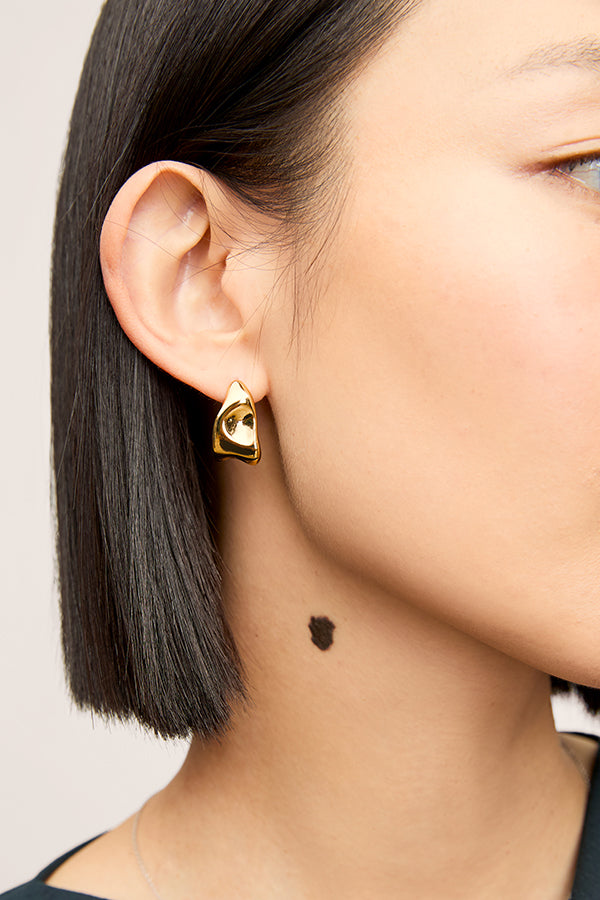image of a woman wearing the lewis earrings in gold | Exclude | Grid Hover