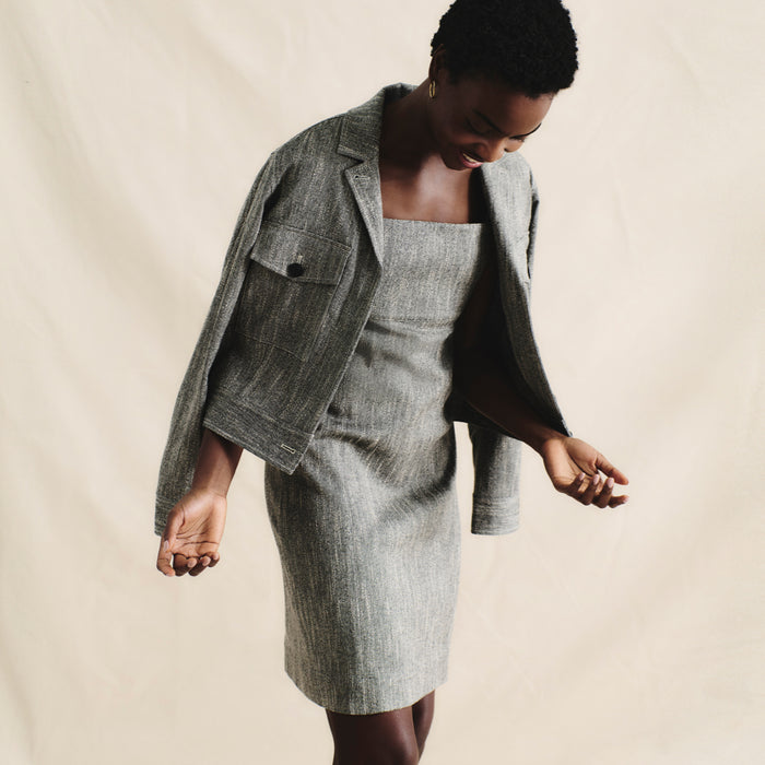 front image of a woman wearing the rhoda jacket in black/ivory