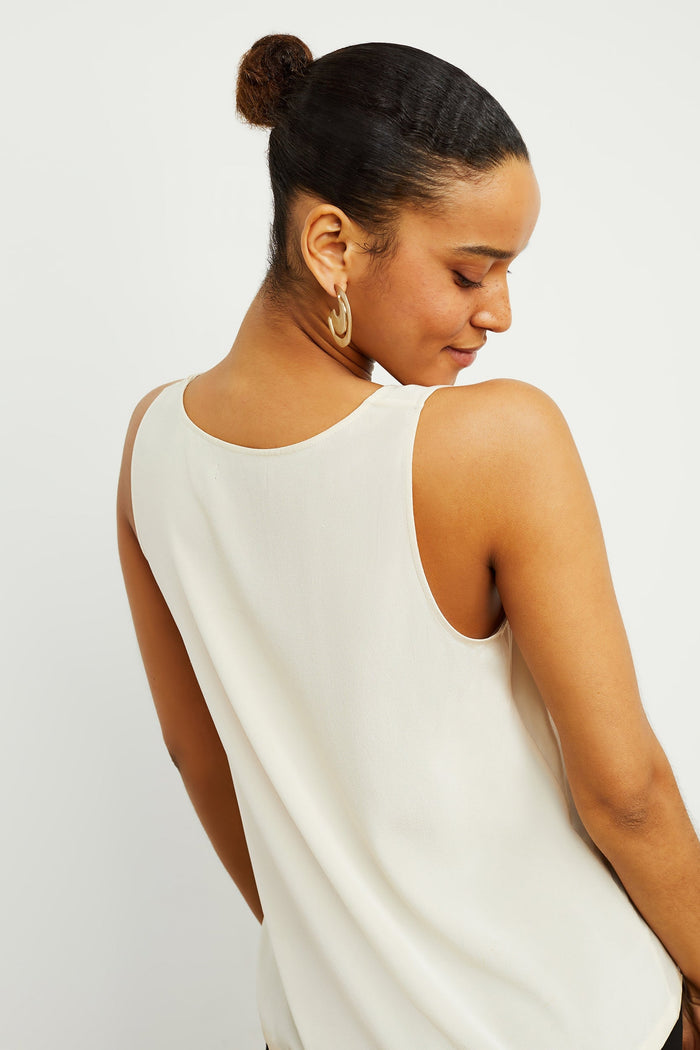 Back image of a woman standing wearing the Vicky Tank—Washable Silk in Pearl | Exclude