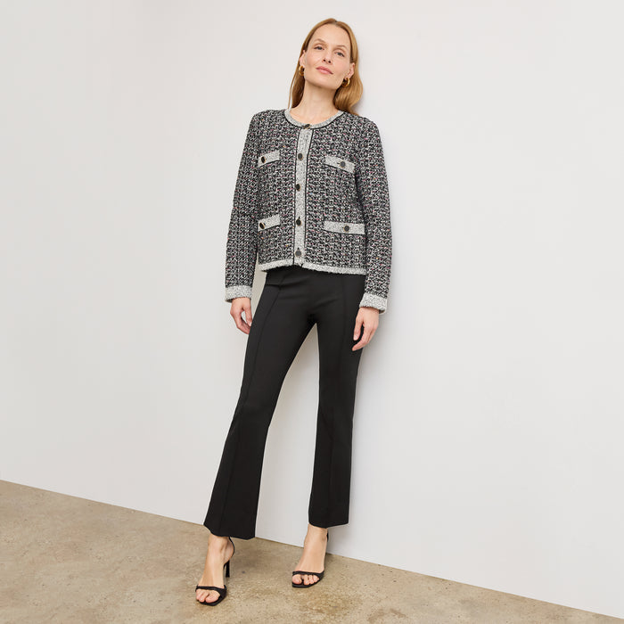 Front image of a woman wearing the allyn pant in black