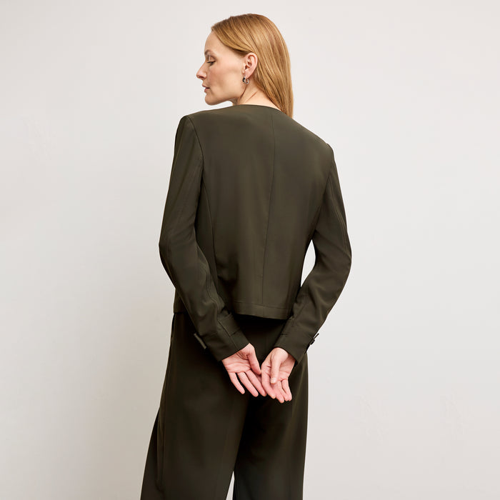 Back image of a woman wearing the Ayla Jacket in Olive