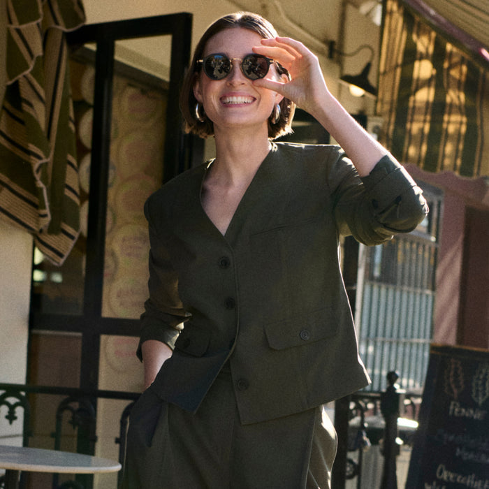 Front image of a woman wearing the Ayla Jacket in Olive