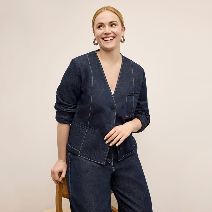 front image of a woman wearing the ayla jacket in midnight wash