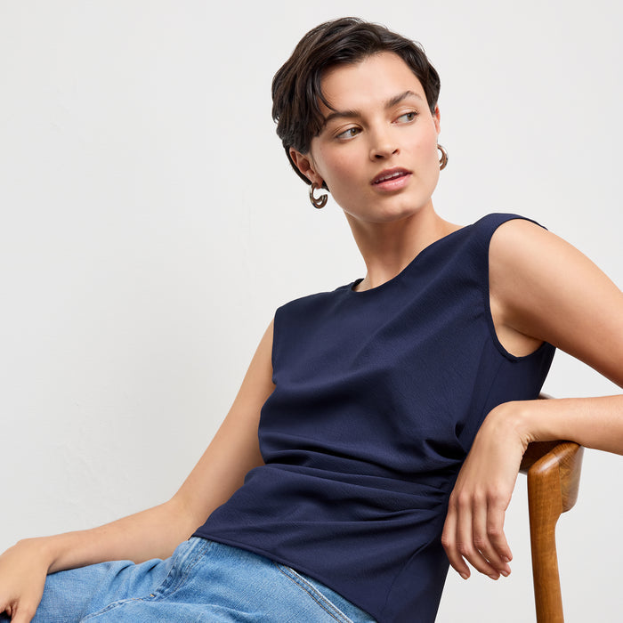 front image of a woman wearing the brooke top in soft navy | Lead