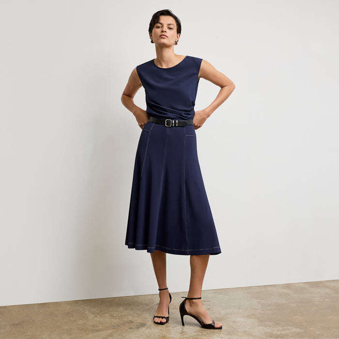 front image of a woman wearing the brooke top in soft navy