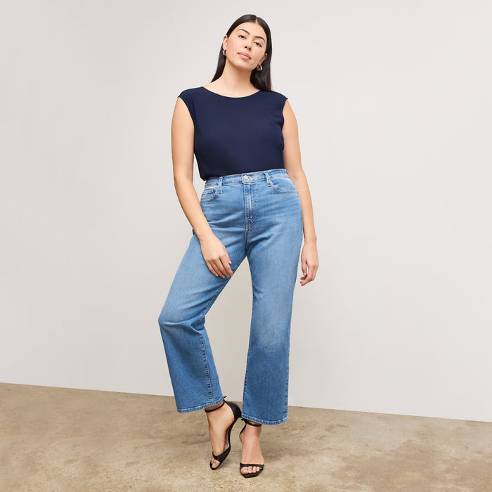 front image of a woman wearing the brooke top in soft navy