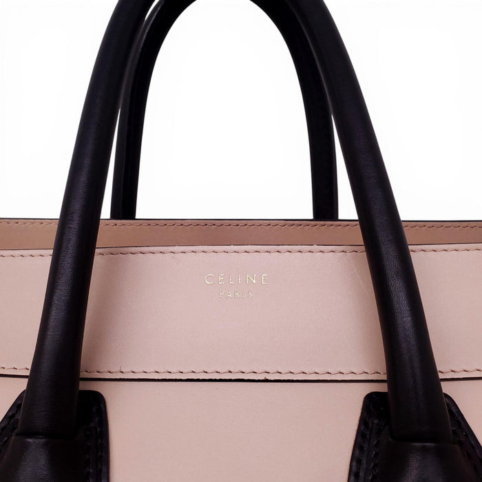 CELINE NUDE AND BLACK LUGGAGE BAG