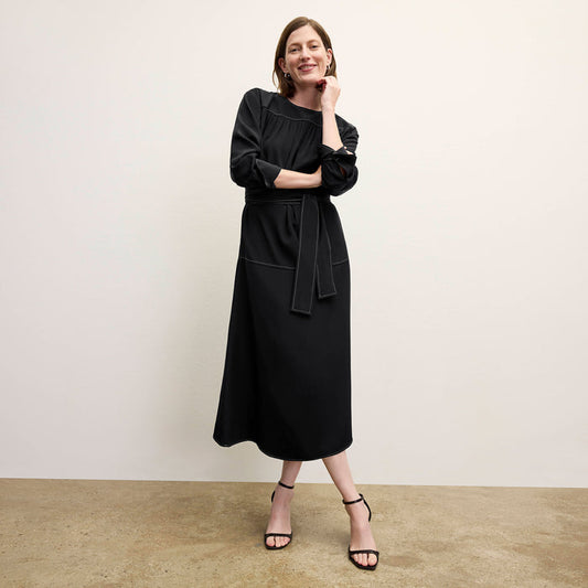 front image of a woman wearing the edie dress in black | Lead