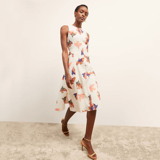 front image of a woman wearing the estela dress in hummingbird print | Lead