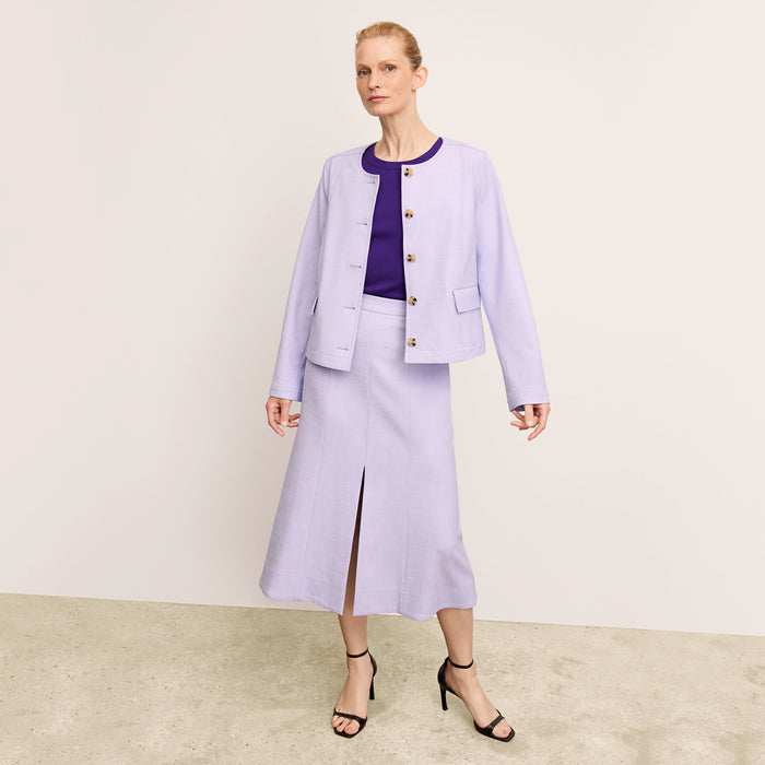 front image of a woman wearing the eva skirt in lilac/ivory