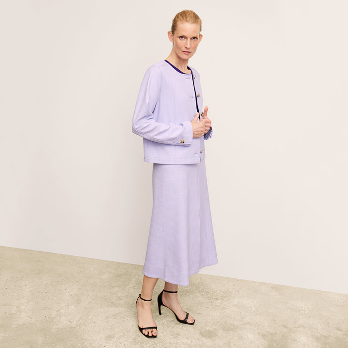 front image of a woman wearing the eva skirt in lilac/ivory