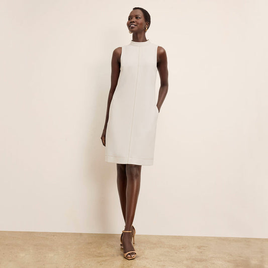 front image of a woman wearing the farren dress in eggshell | Lead