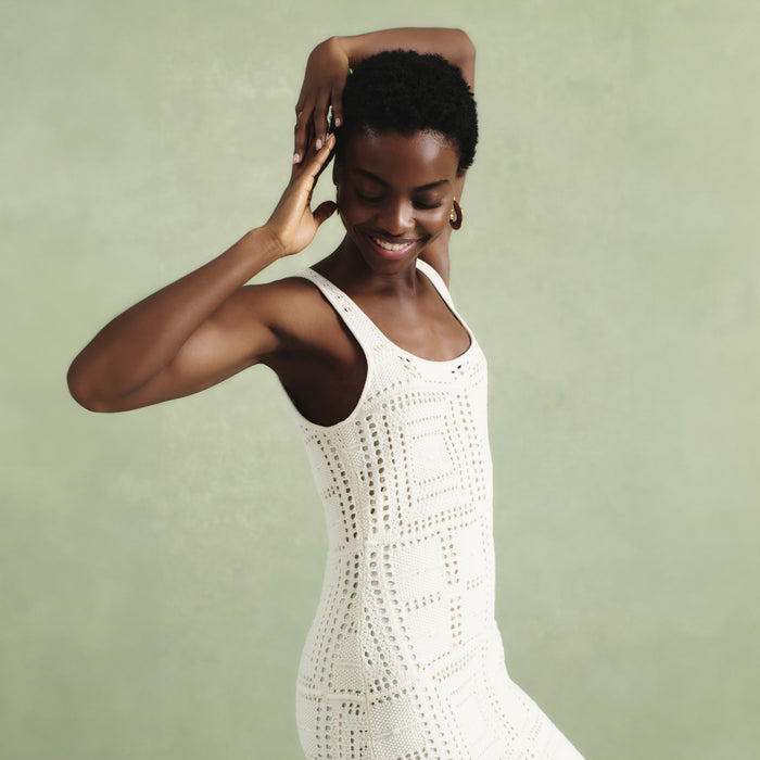 front image of a woman wearing the fina dress in natural