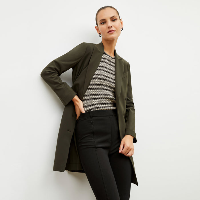 Front image of a woman wearing the gwynne dress in olive