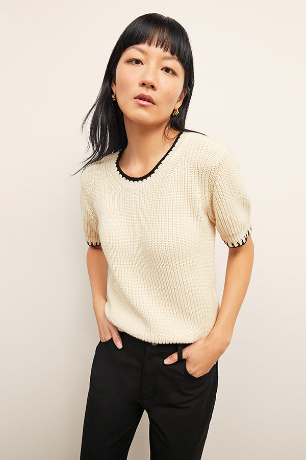 front image of a woman wearing the hallie top in contrast knit | Exclude | Grid