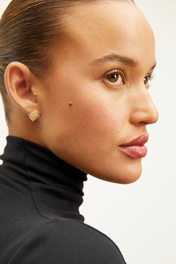 image of a woman wearing the indira earrings in gold | Exclude | Grid Hover
