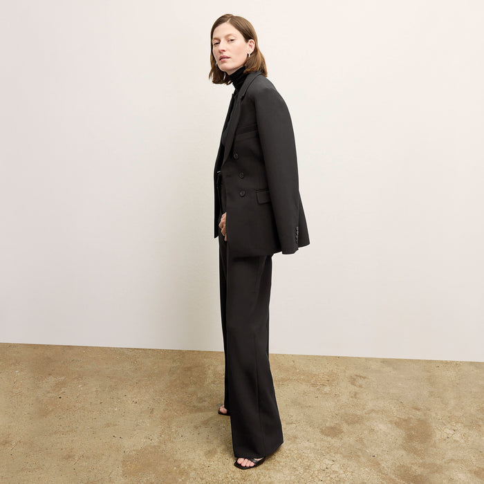 side image of a woman wearing the kati jacket in black