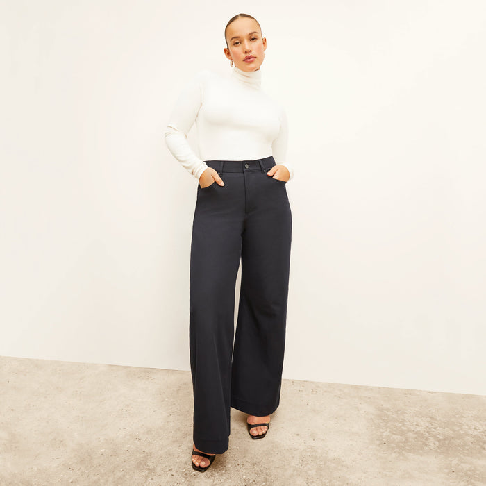 Front image of a woman standing wearing the Milo Jean in ink