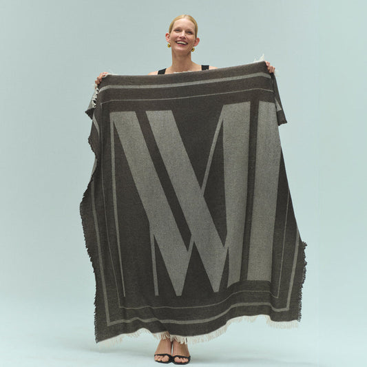 front image of a woman holding the GWP Blanket | Lead