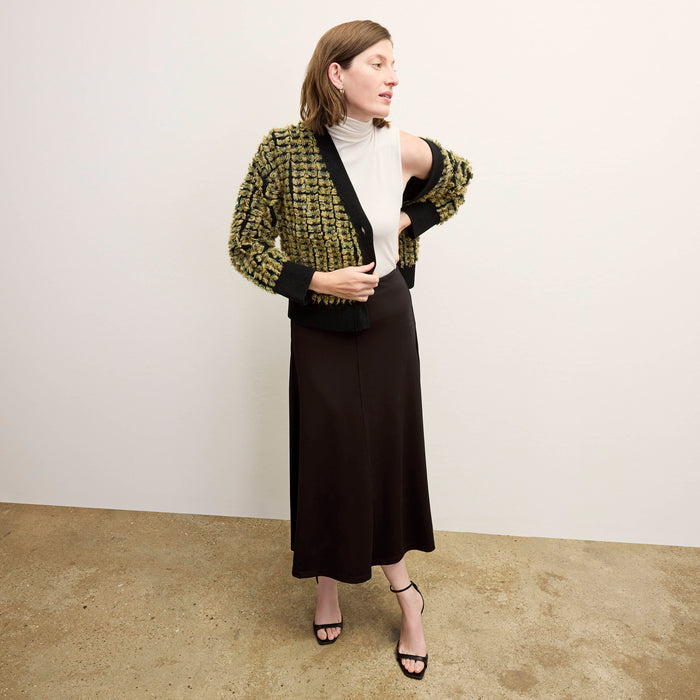 Front image of a woman wearing the rayna cardigan and the Jett Tank in Ivory | Exclude