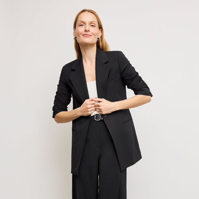 front image of a woman wearing the rossi blazer in black | Lead
