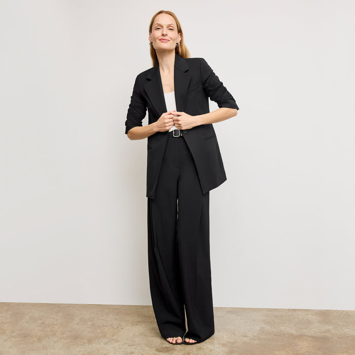 front image of a woman wearing the rossi blazer in black | Exclude