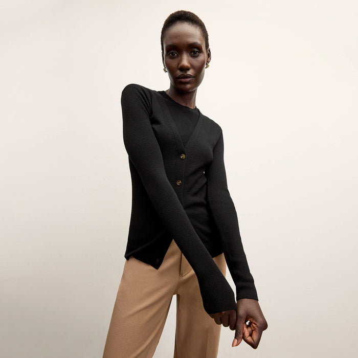 front image of a woman wearing the trina top in black