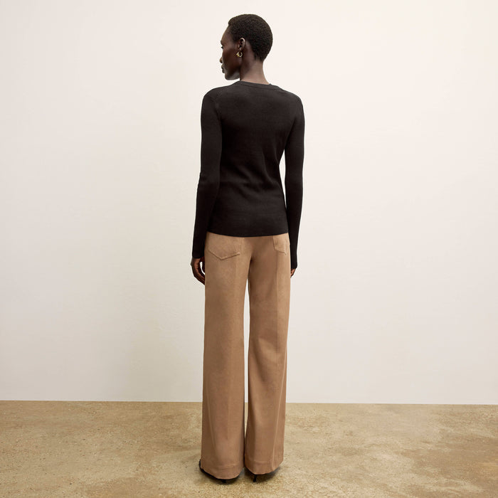 back image of a woman wearing the watson cardigan in black
